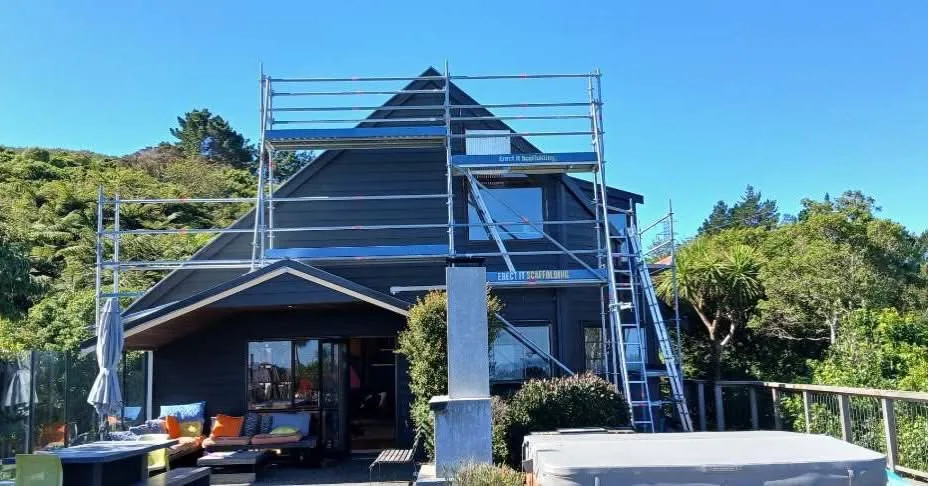Multi-level exterior cladding repair and repaint scaffolding on a modern hillside home in Belmont, Lower Hutt — Erect It Scaffolding