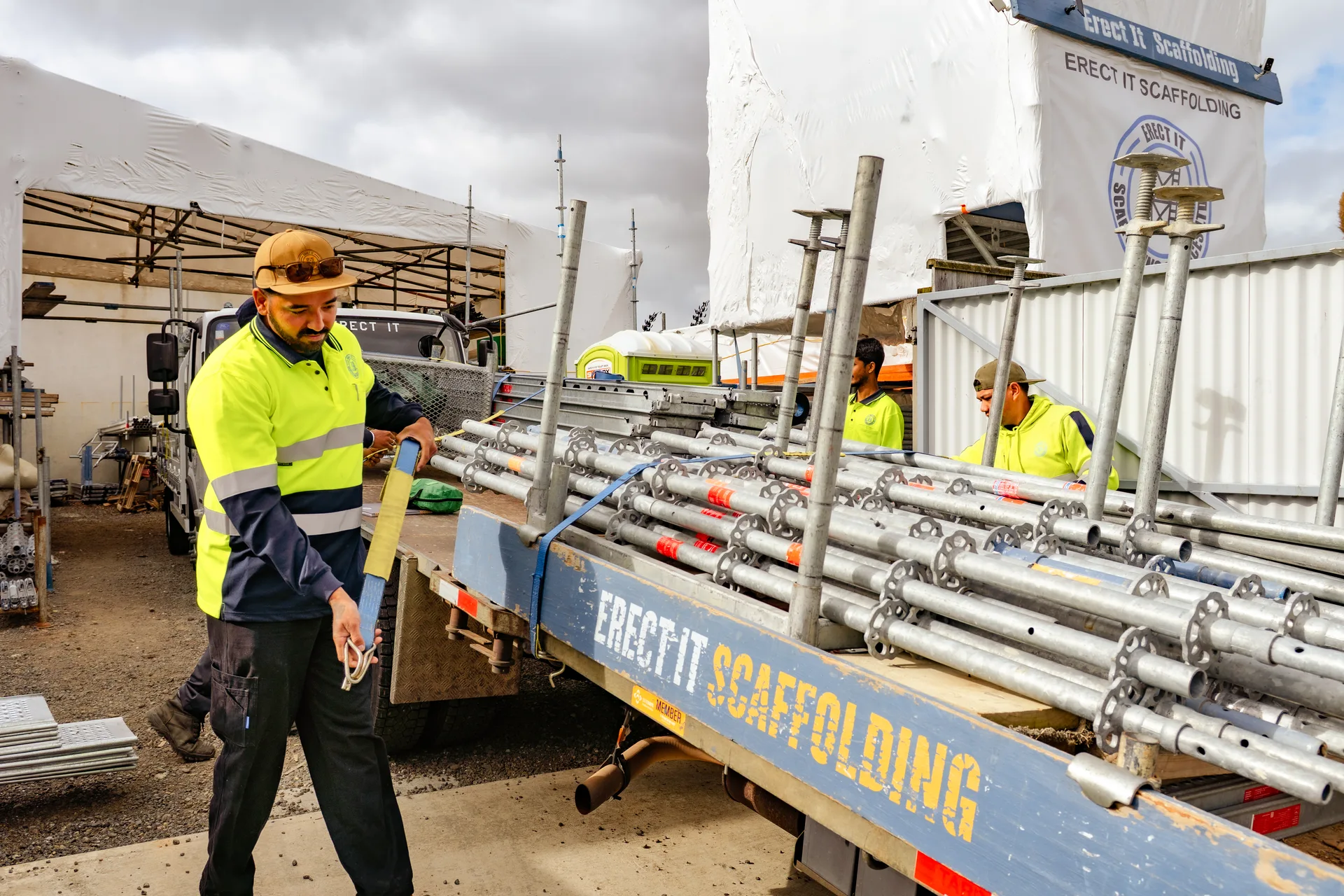 Crew strapping ringlock onto the branded truck at the Plimmerton yard