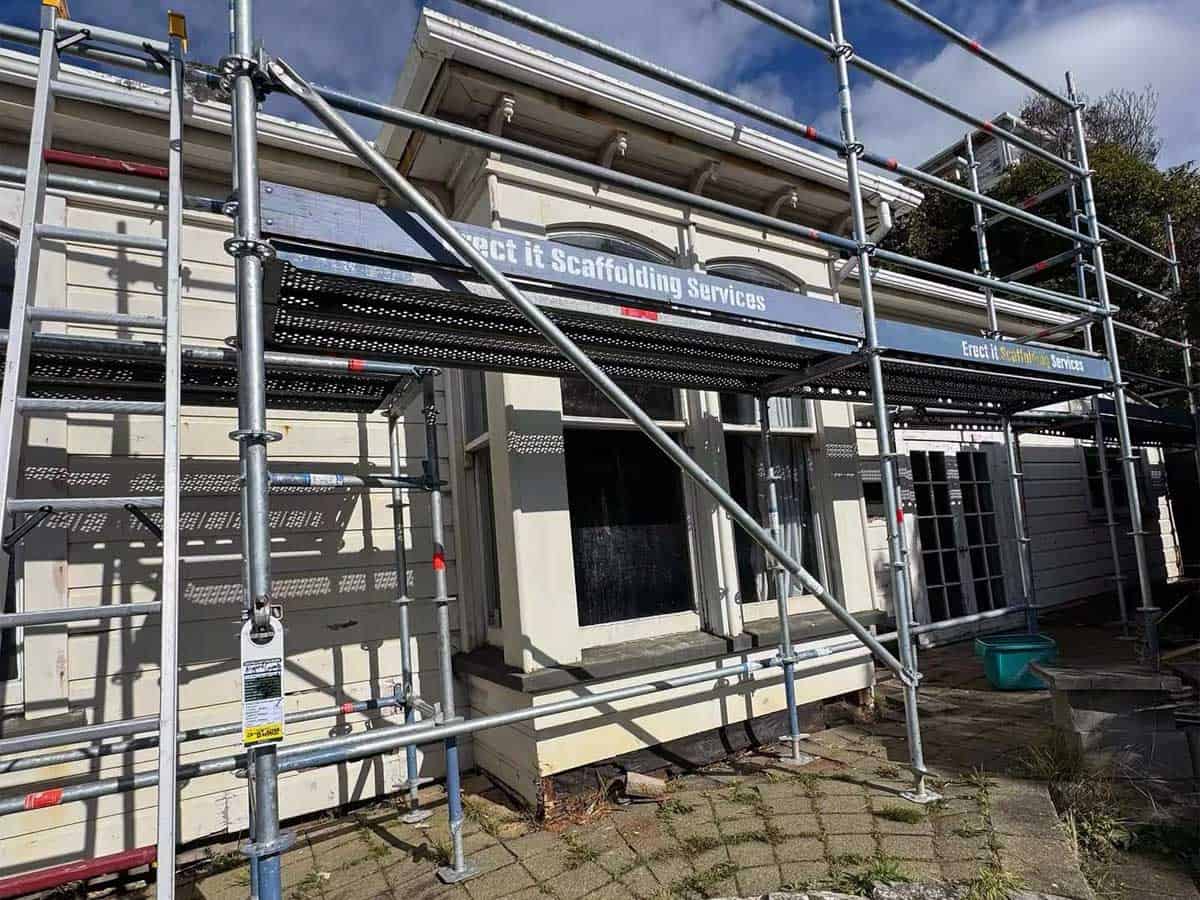 Erect It scaffolding with branded banners on a heritage villa in Aro Valley, Wellington