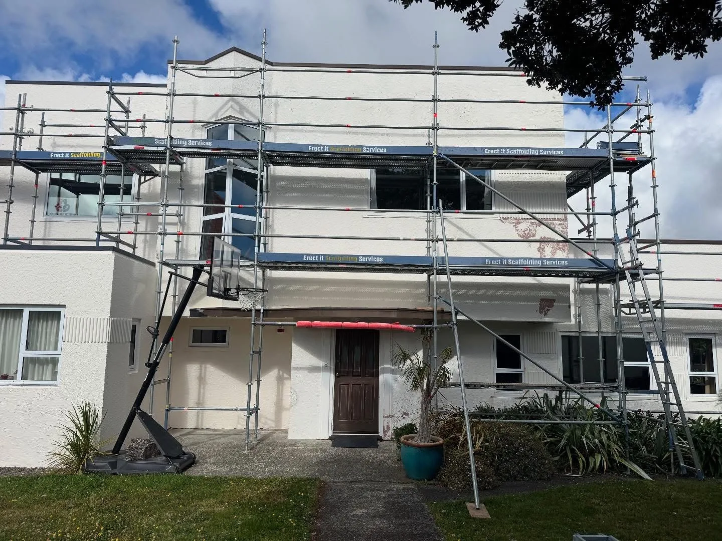 Multi-level scaffolding installed across the front of a Karori building for exterior painting
