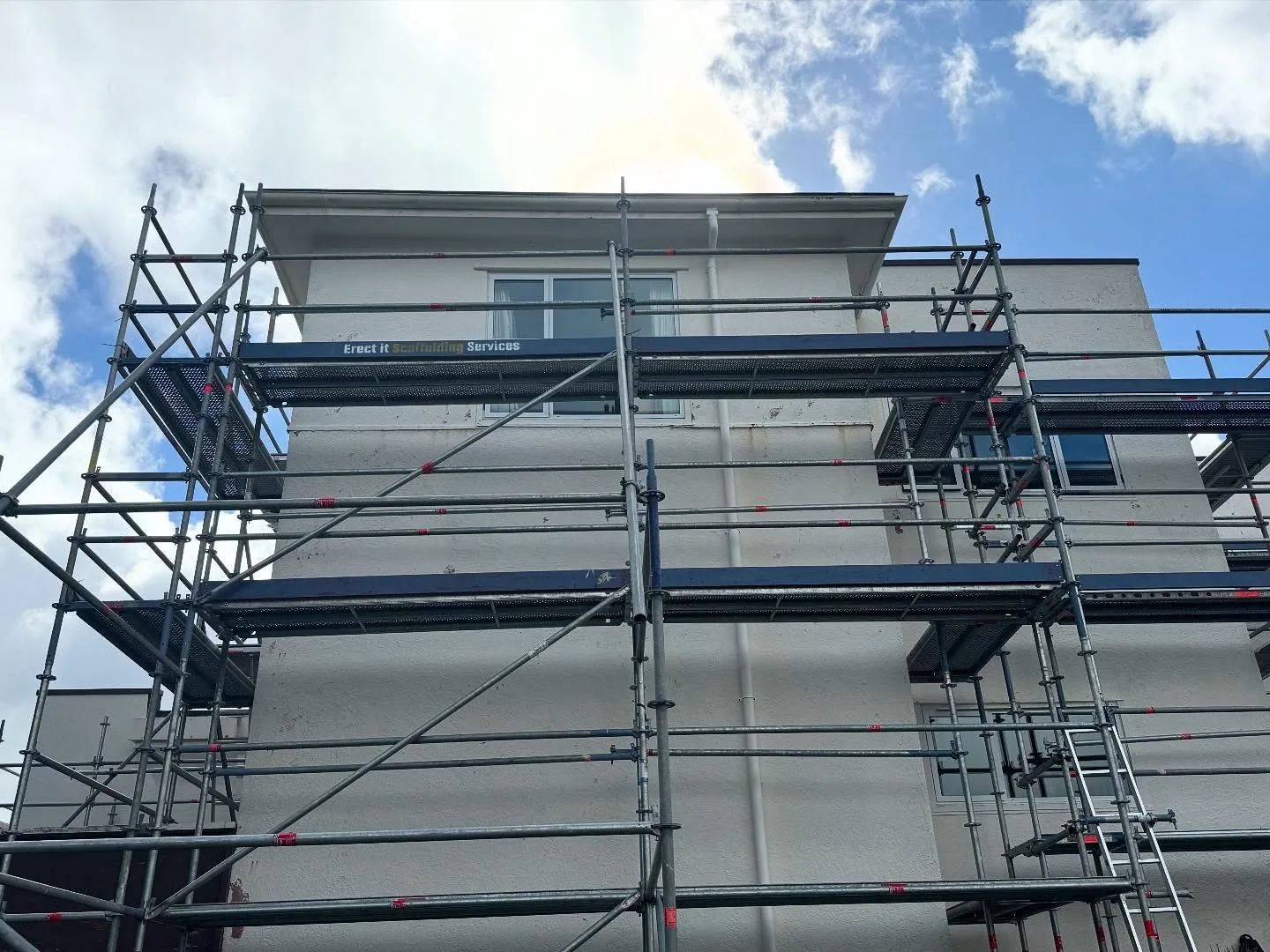 Upper-level scaffold platforms around a Karori property prepared for exterior painting