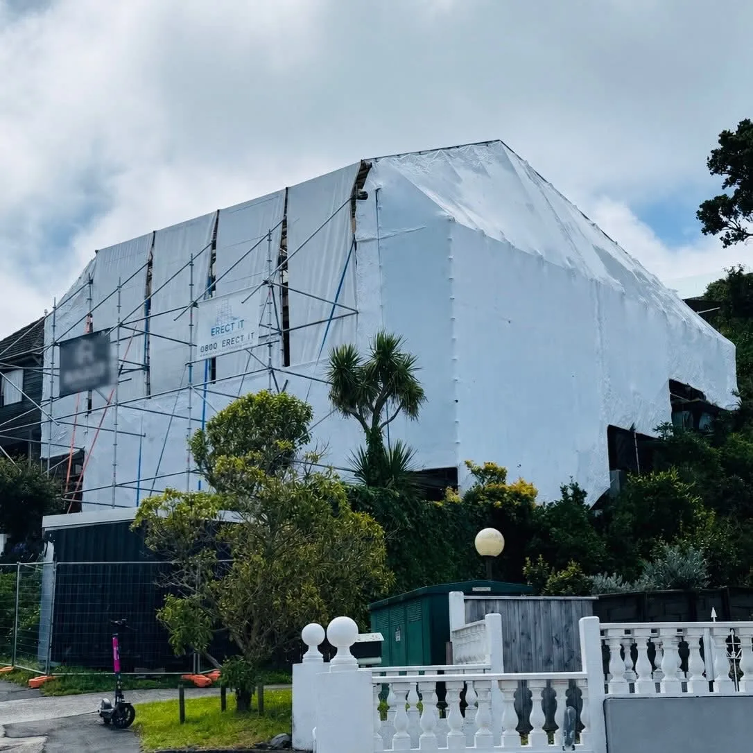 Full scaffolding shrinkwrap encapsulation on a two-storey home in Khandallah, Wellington for reclad, reroof and new window installation — Erect It Scaffolding