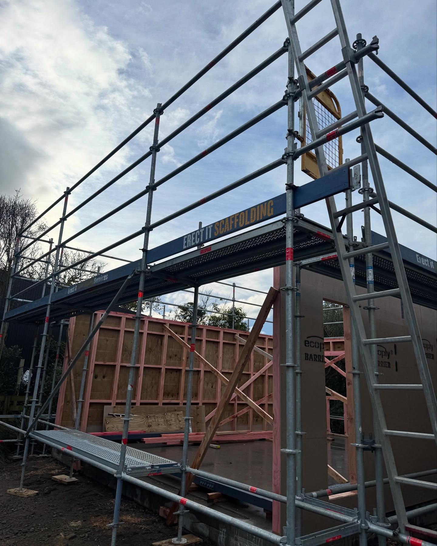 Erect It Scaffolding erected around a new garage build on Weld Street, Martinborough, Wairarapa — Layher system scaffold with guardrails and decked platforms