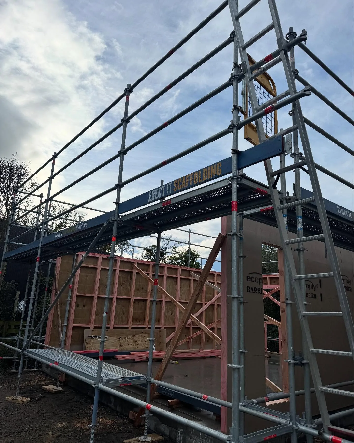 Erect It Scaffolding erected around a new garage build on Weld Street, Martinborough, Wairarapa — Layher system scaffolding with guardrails and decked platforms