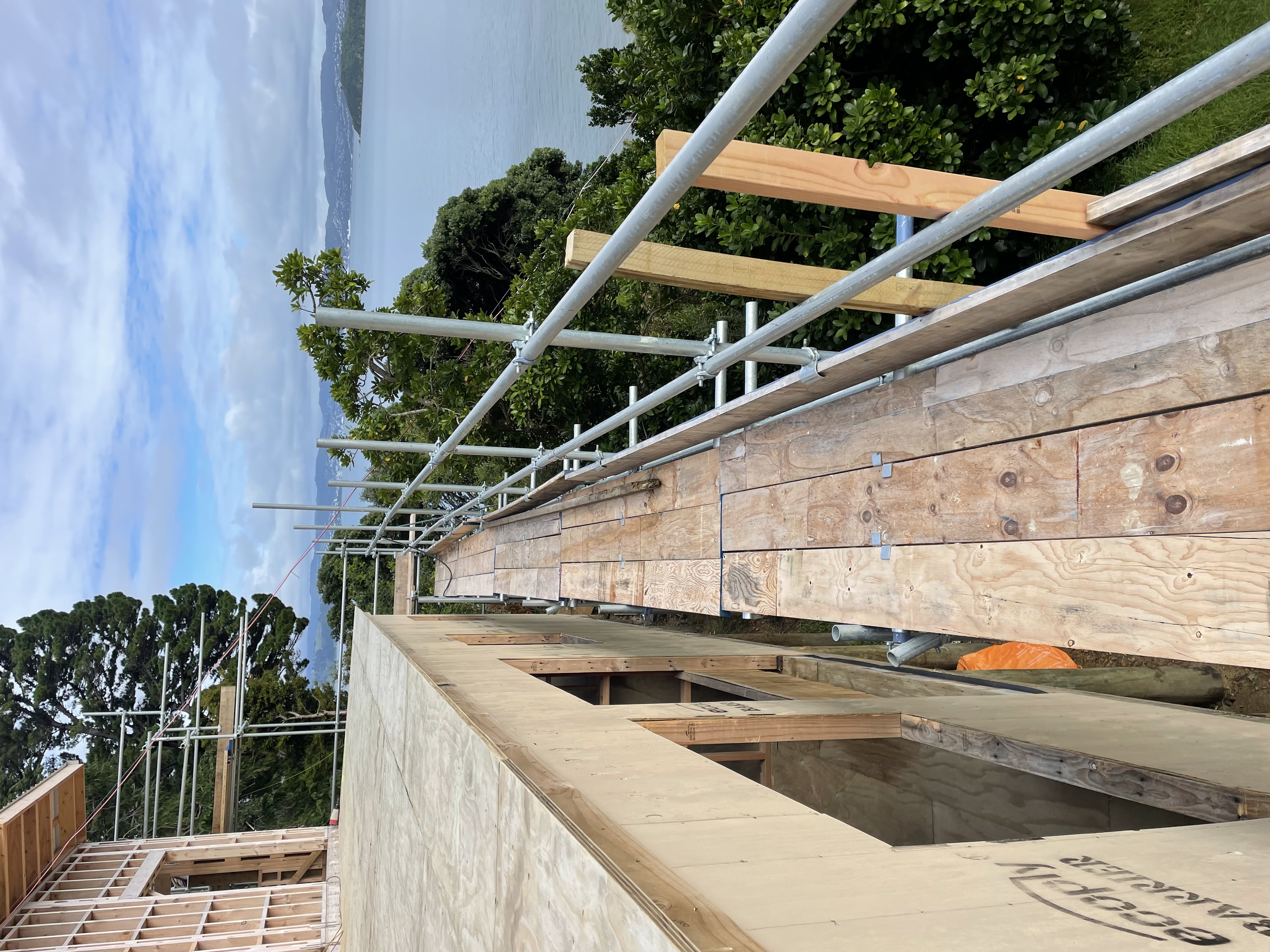 Full perimeter scaffolding for residential new build in York Bay, Lower Hutt — Erect It Scaffolding truck on site