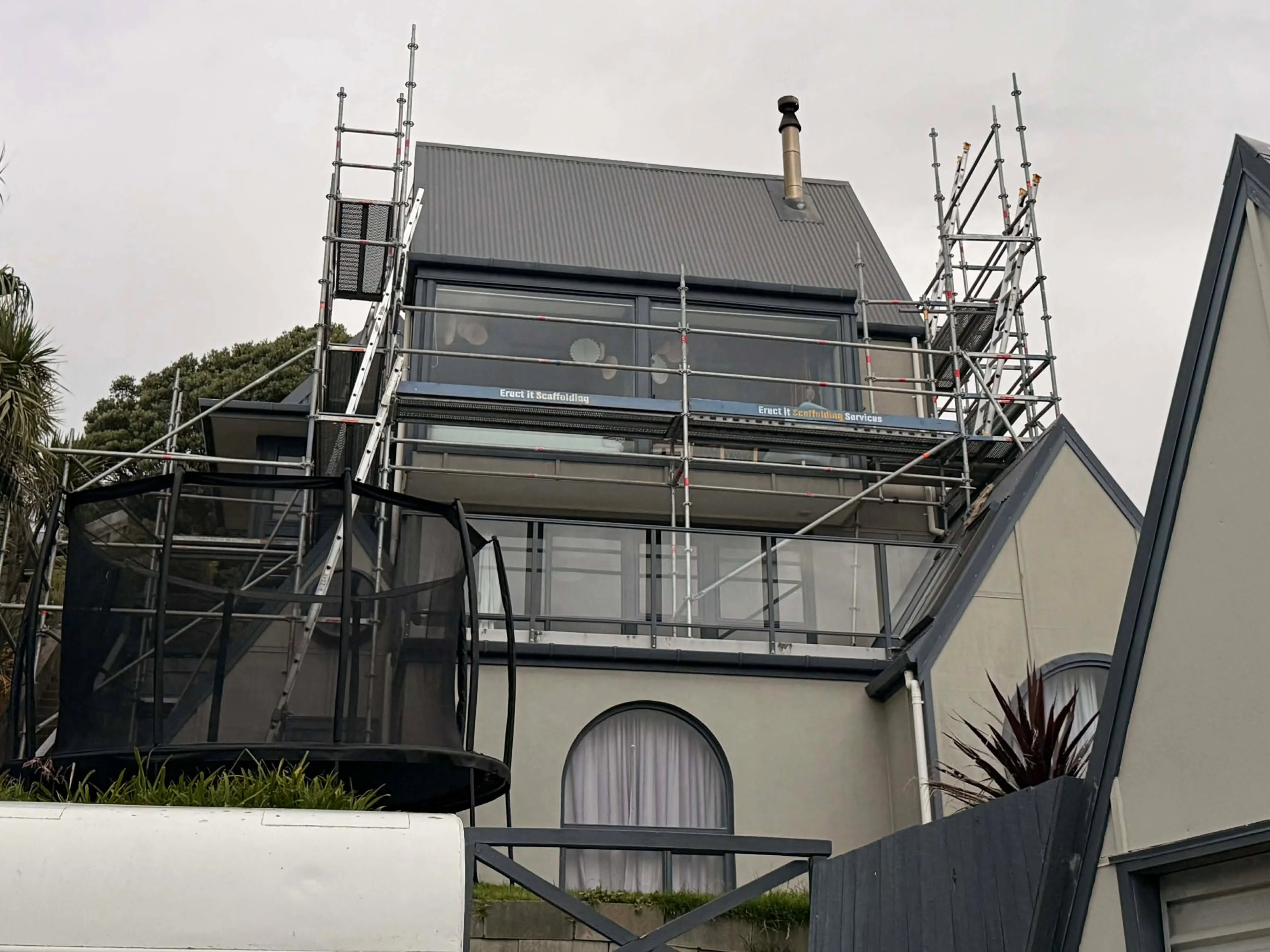 Full-perimeter scaffolding installed around a Paekākāriki home for exterior restoration work