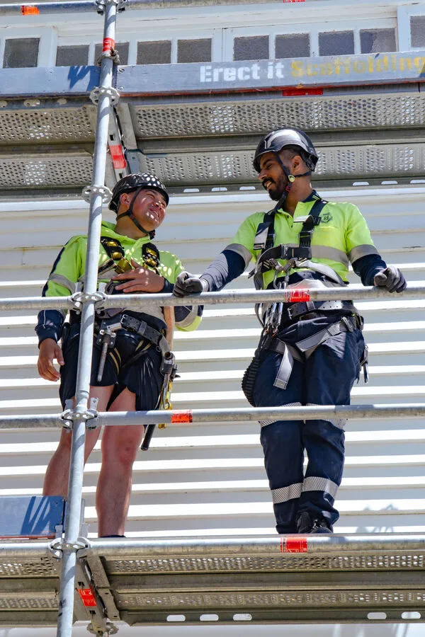 Two of our crew — Erect It Scaffolding in the background