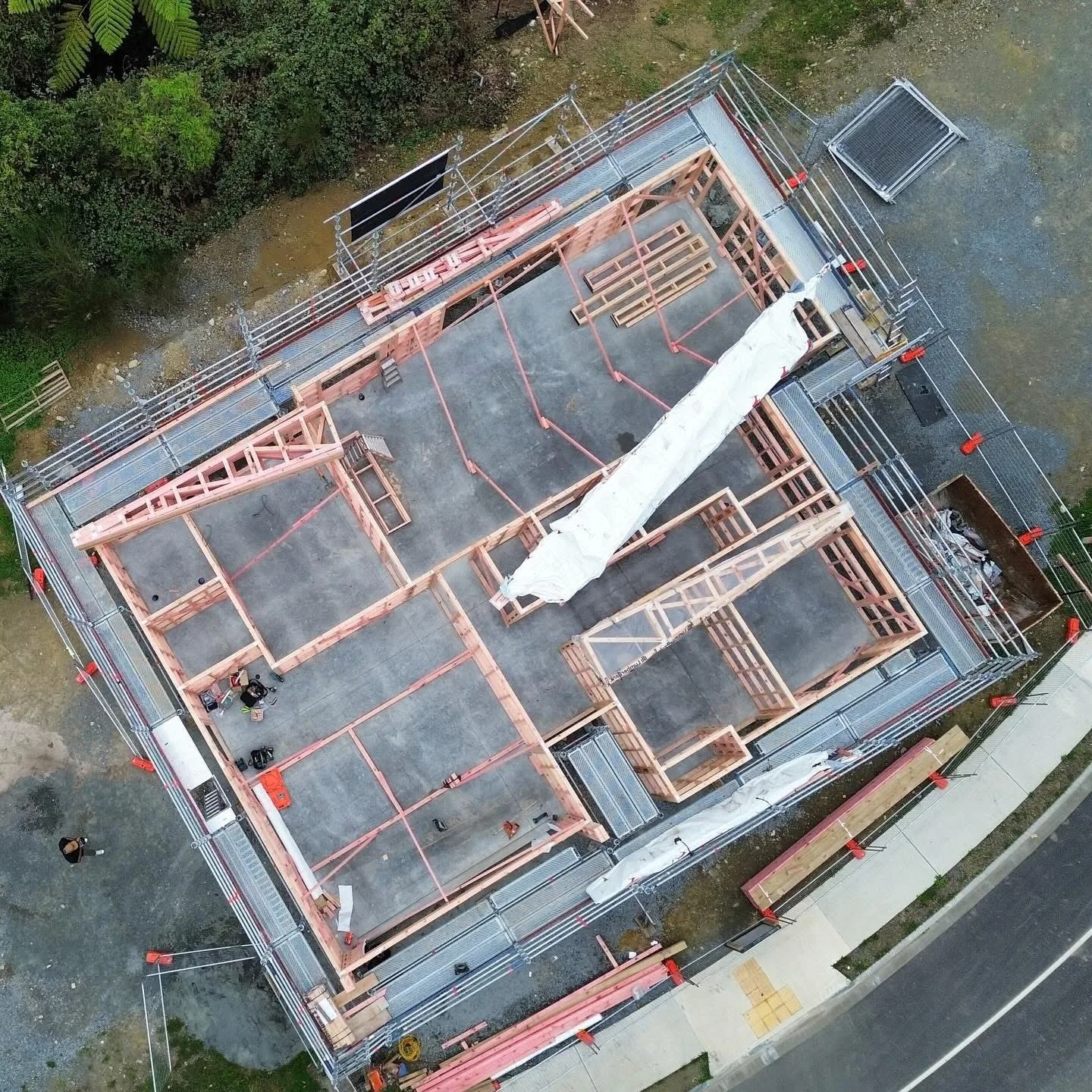 Aerial drone view of Erect It Scaffolding on a new residential build in Trentham, Upper Hutt — full scaffolding perimeter visible from above