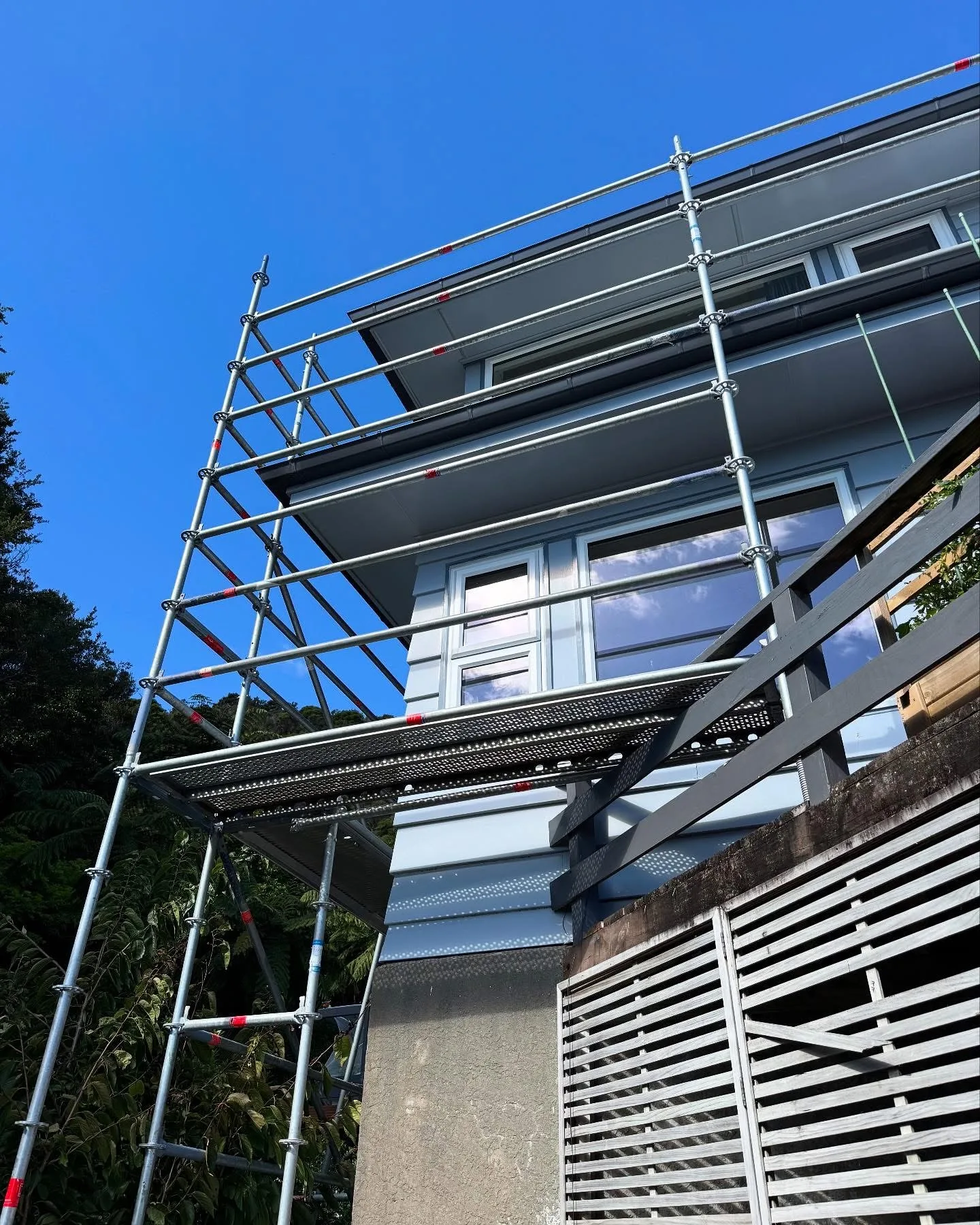 Scaffolding erected beside a Waiwhetū home for exterior restoration work